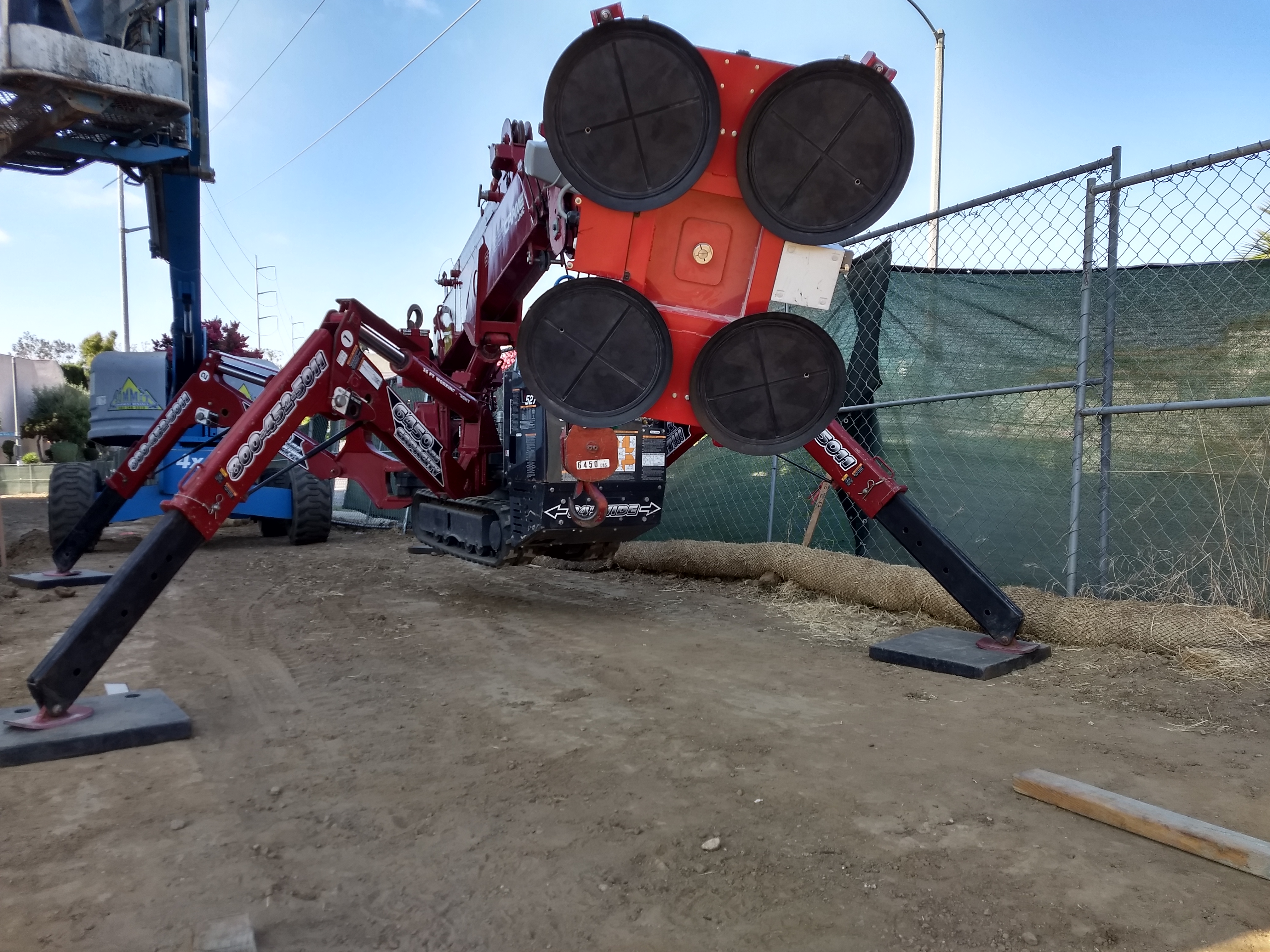 SPYDERCRANE mini crawler crane on a jobsite near Gardena