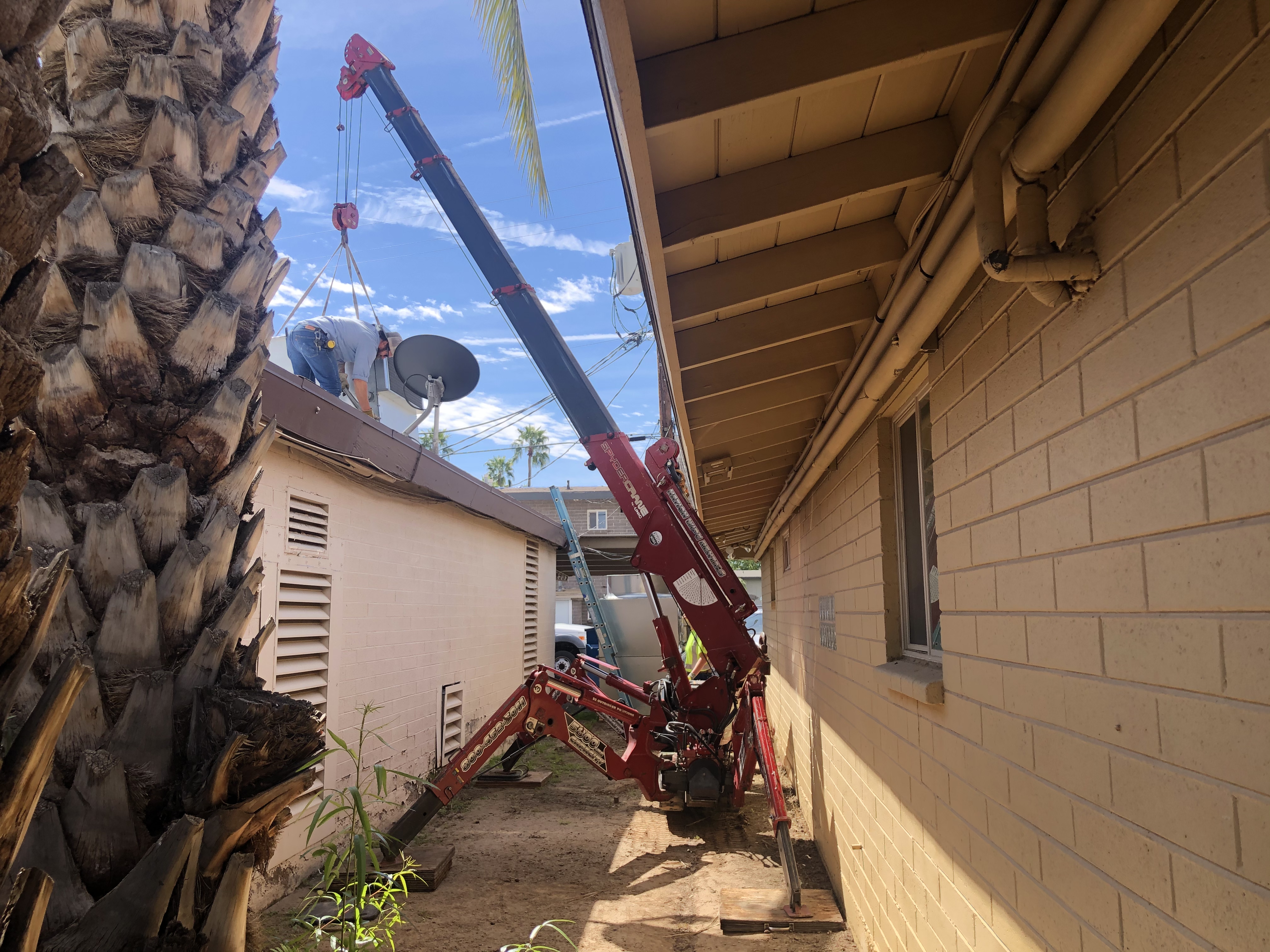 SPYDERCRANE mini crawler crane on a jobsite near Phoenix