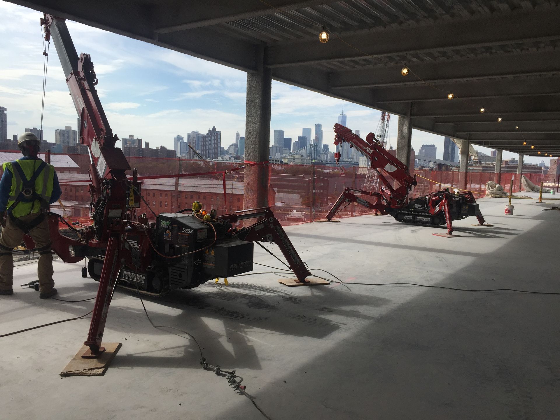 SPYDERCRANE mini crawler crane working on a jobsite