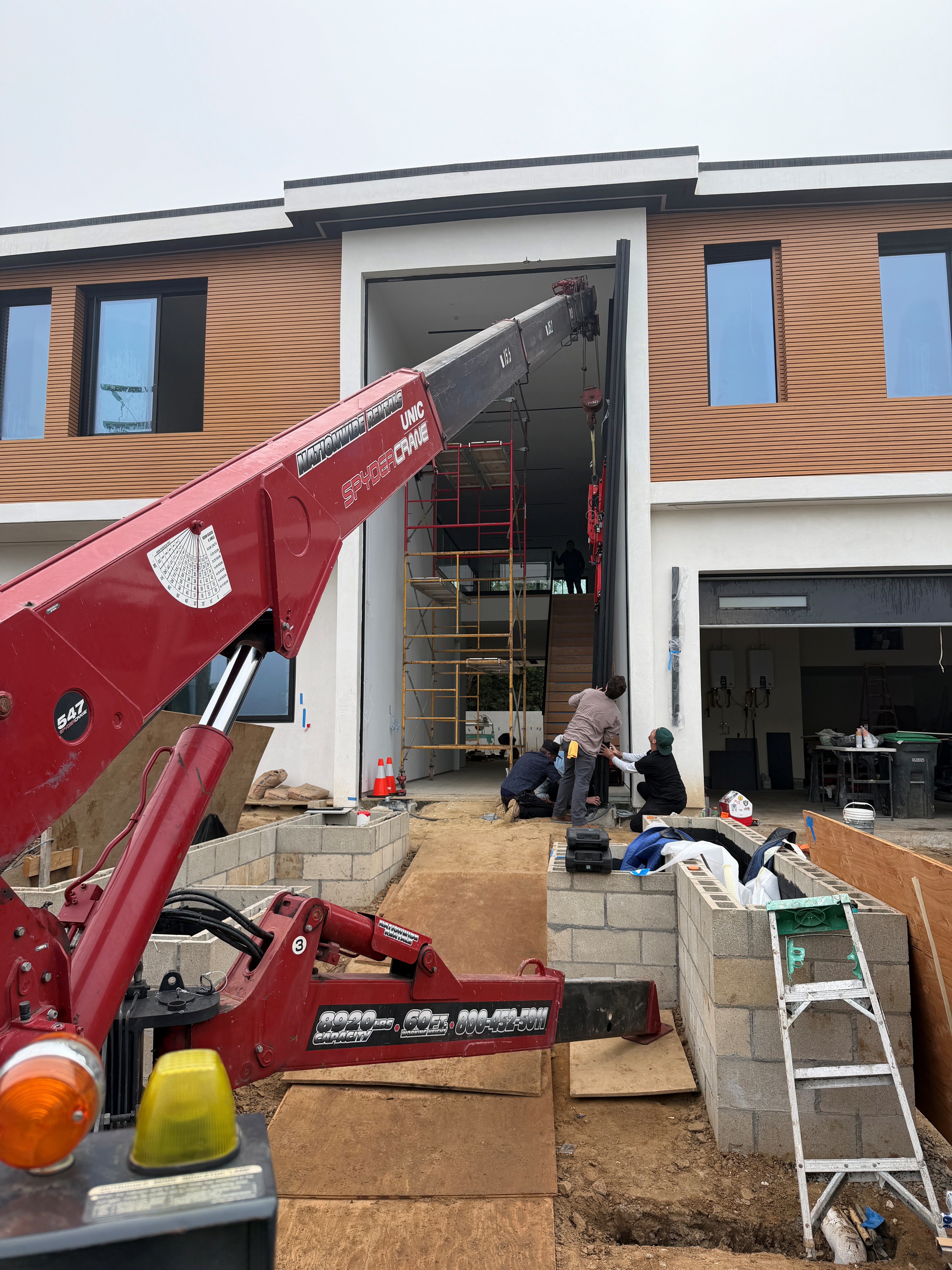 SPYDERCRANE mini crawler crane on a jobsite